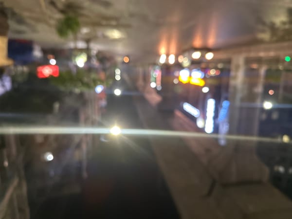 Evening scenes captured in Dhaka: wet streets, restaurant interior