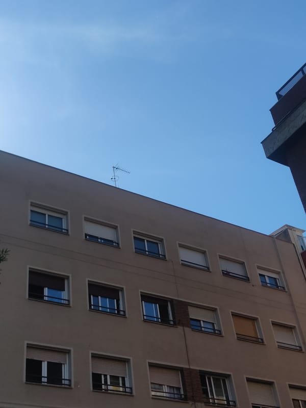 Urban apartment buildings photographed from street level perspective