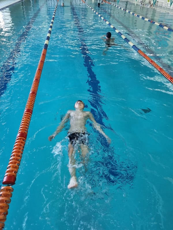 Early morning swimming session at indoor pool facility