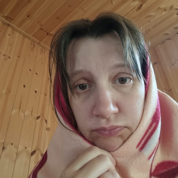 Lazy evening in a wooden cabin, blanket and travel mug.