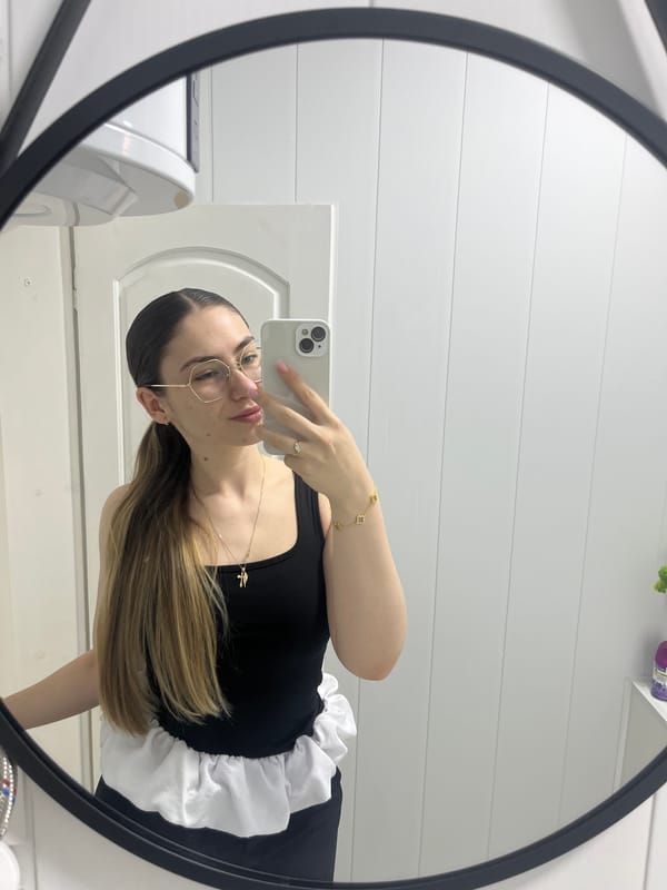 Woman takes mirror selfies in bathroom during morning routine