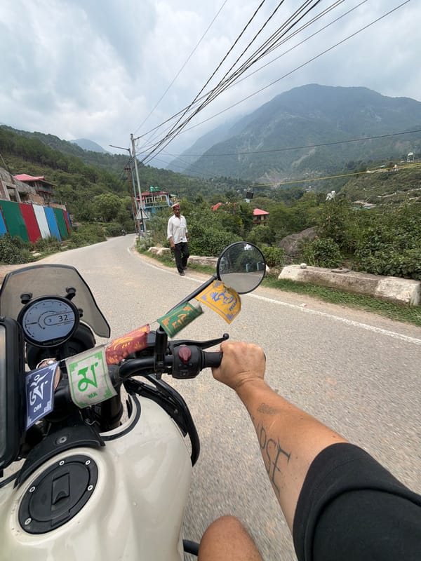 Motorcycle ride through misty Himachal mountain valleys