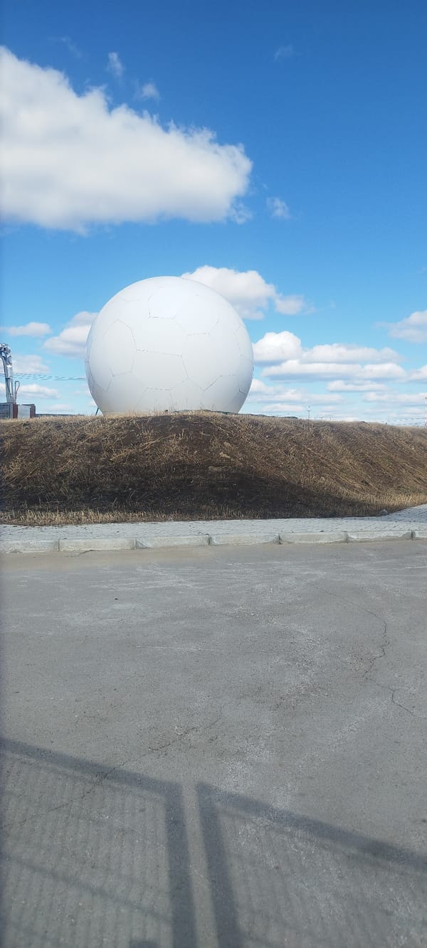 Morning scenes captured around Yakutsk including radome, travelers, traffic