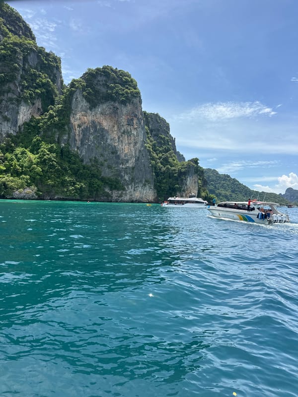 Speedboat moving through limestone island waters near Ao Nang