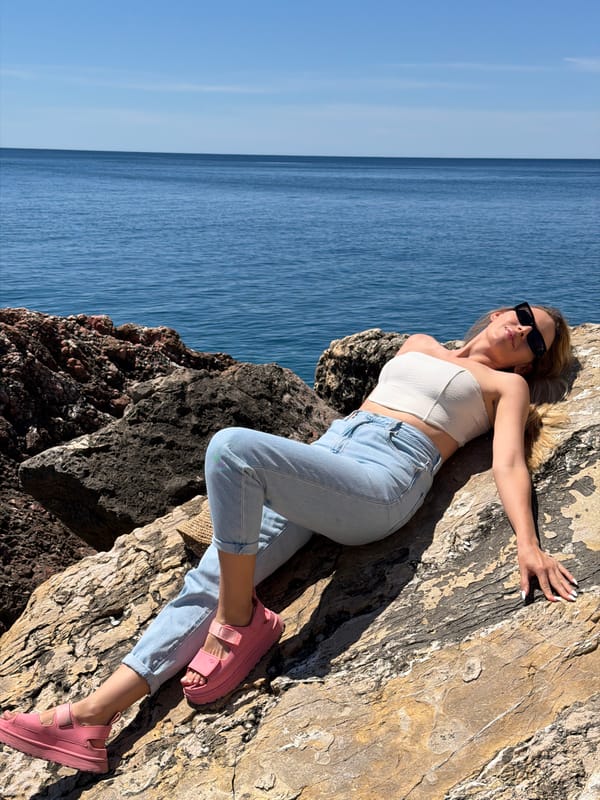 Woman poses for photos along Montenegro coast in Petrovac