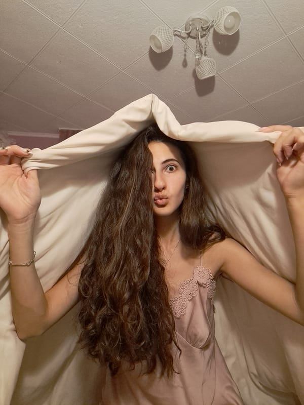 Woman takes bedroom selfies in Chepintsi, Bulgaria