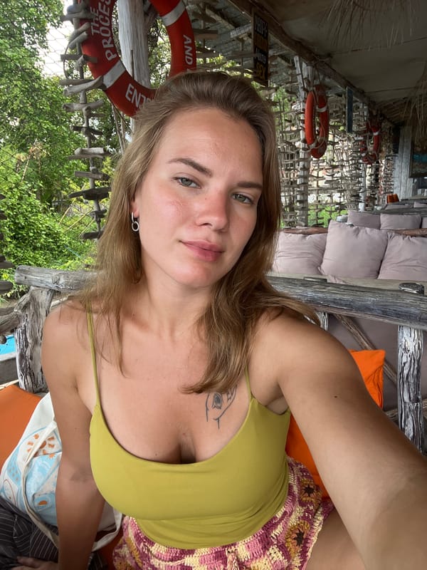 Woman takes selfie at beachside cafe in Buleleng