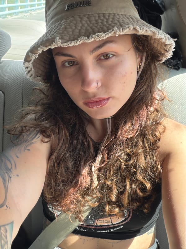 Woman takes selfie during morning journey through Jordan mountains