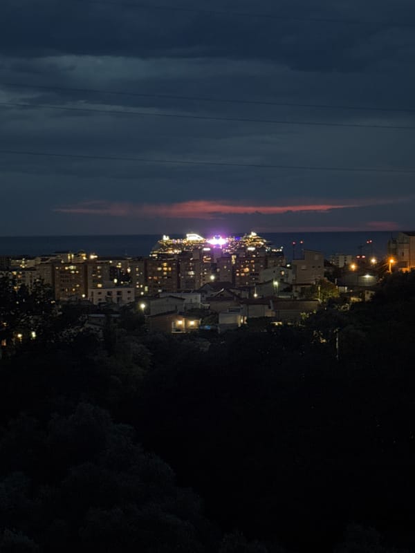 Cruise ships light up the bay at Sustaš, Montenegro after dark