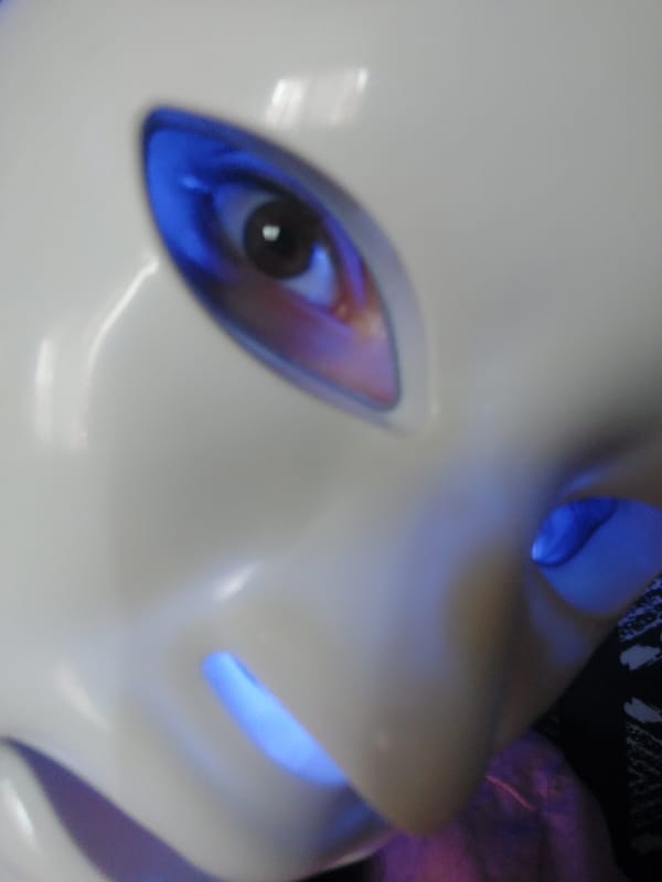 Glowing mask with human eyes photographed by witness