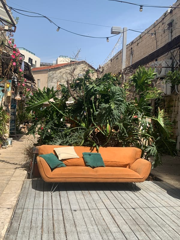 Couch spotted on wooden deck in Tel Aviv