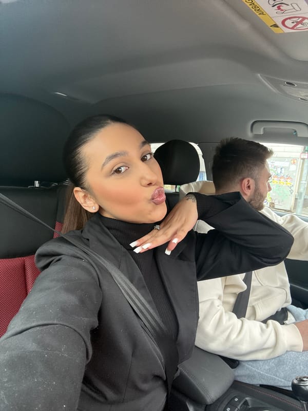 Woman takes selfie with passenger in car, Mönchengladbach