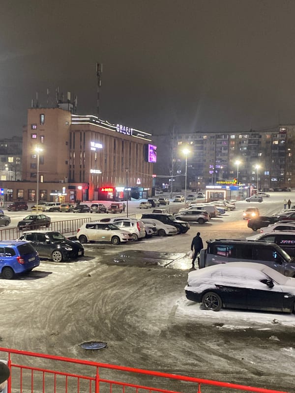 Person observed in winter evening scene in Izhevsk