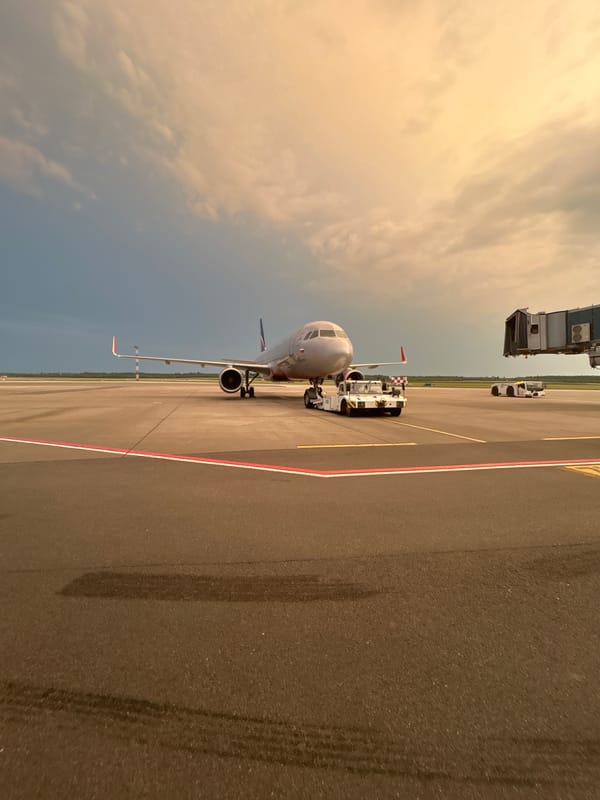 Aircraft towed at dusk on Minsk airport tarmac
