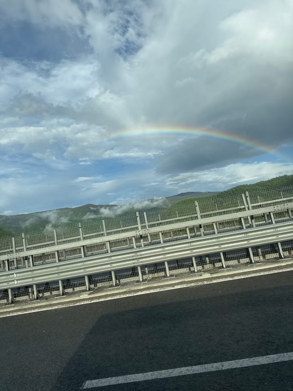 Rainbow spotted over mountain road in Vrachesh, Bulgaria