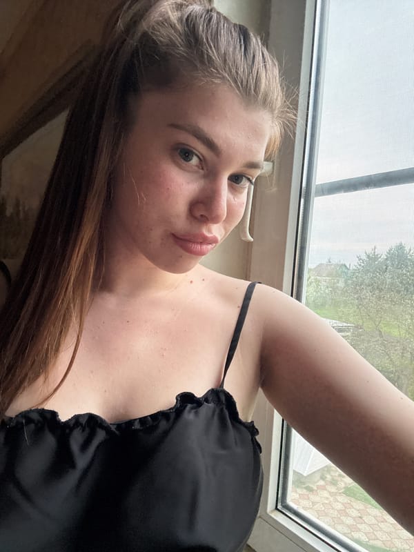 Woman takes selfies by window in Мещёры, Russia