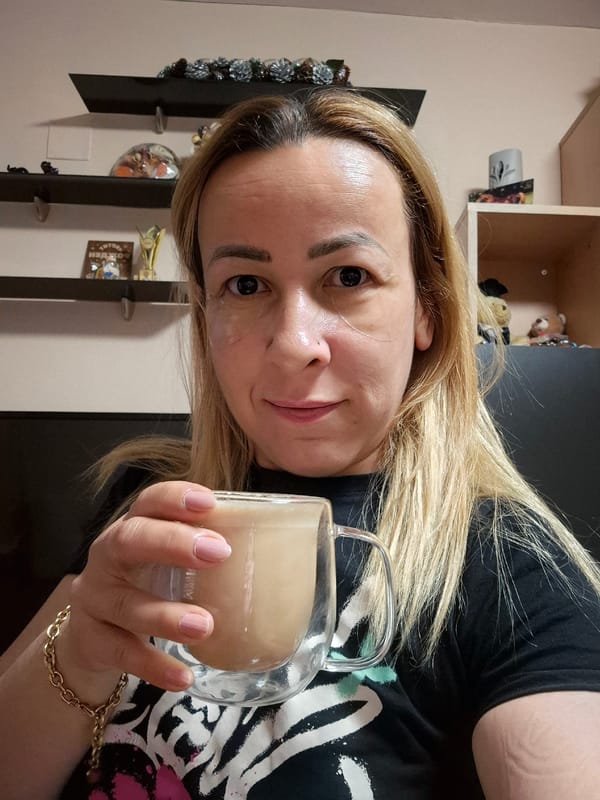 Morning drink in hand, under-eye patches, relaxed home setting.