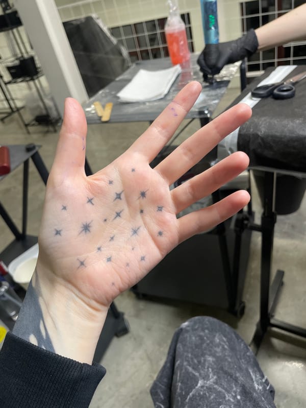 Palm tattoo session documented at Moscow studio
