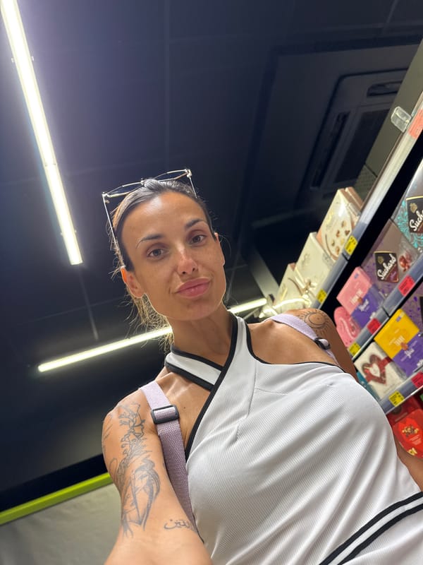 Selfie moment in a well-lit Pleven grocery store aisle