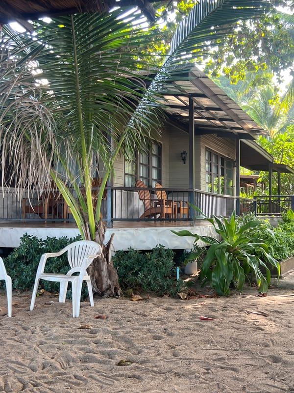 Lazy beach morning with jewelry, books, and bungalow views