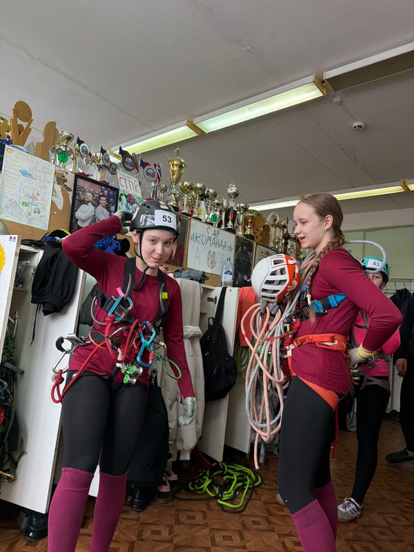 Climbers prepare gear indoors in Berezniki, Russia