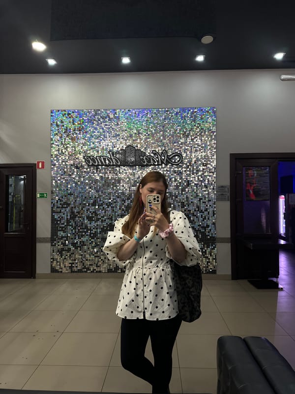 Selfies at a sequined wall inside a Petropavlovsk-Kamchatsky venue