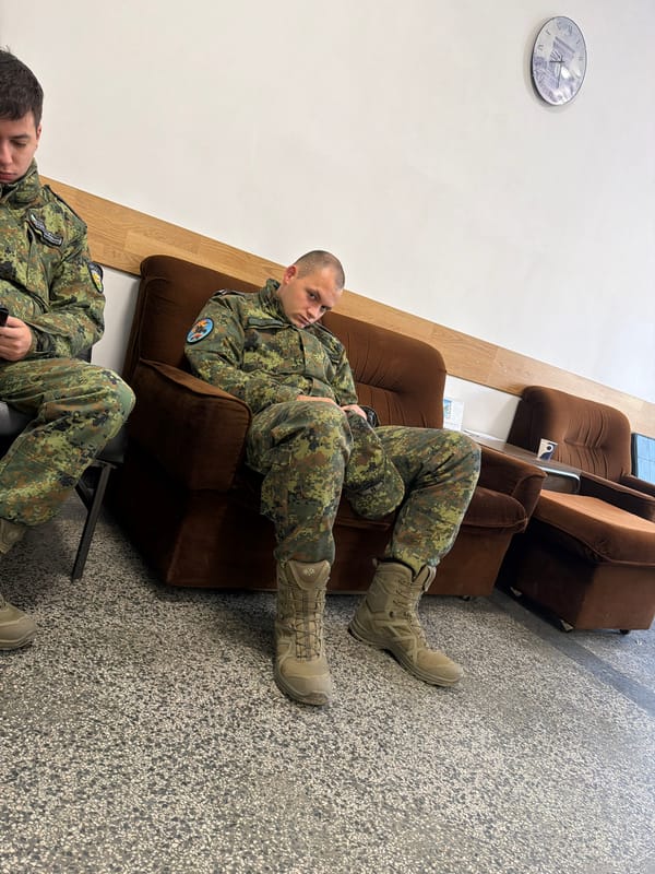 Military personnel rest indoors in Bulgarian town