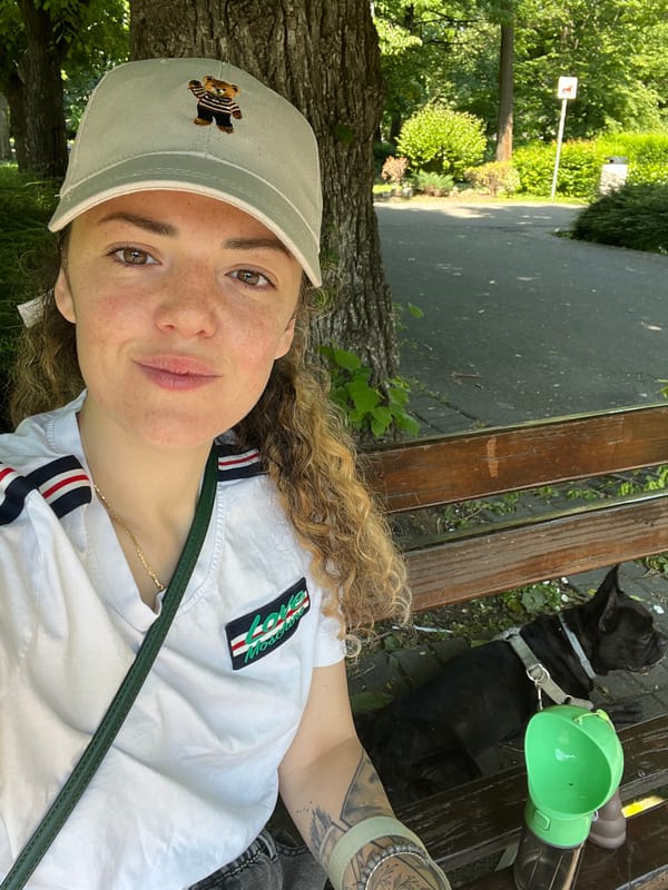 Woman with black dog enjoys morning in Burgas park