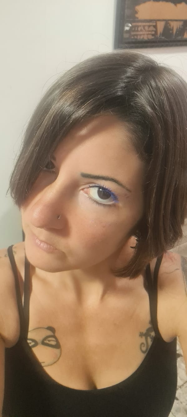 Woman applies blue mascara, takes selfies in Nahariyya home