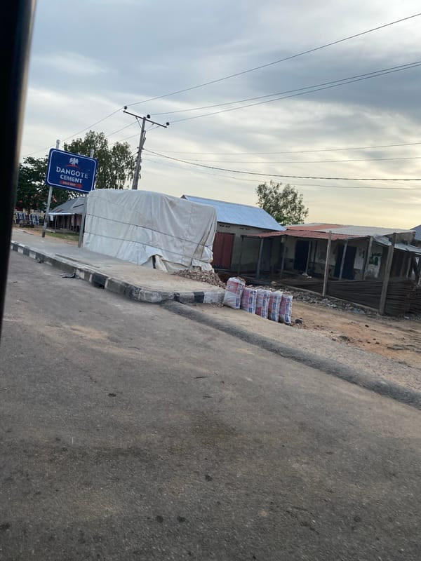 Drive through Jalingo streets with urban infrastructure and signage