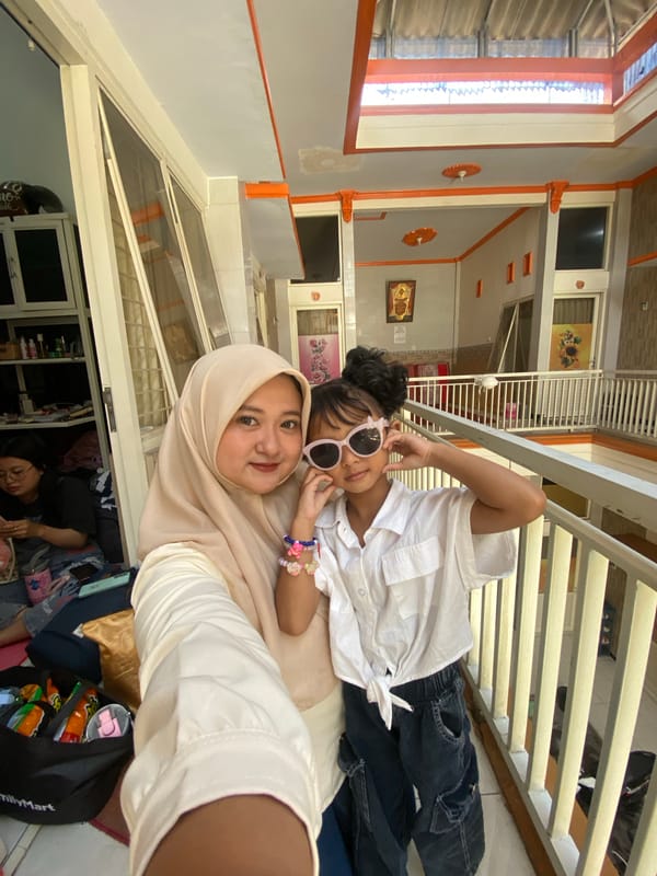 Family selfie session captured in Jember home