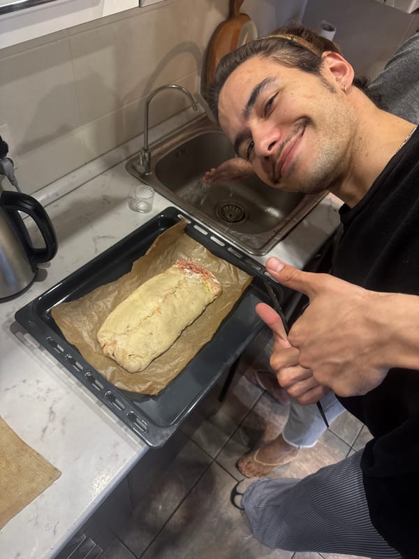 Man photographs homemade meatloaf in Sevastopol kitchen