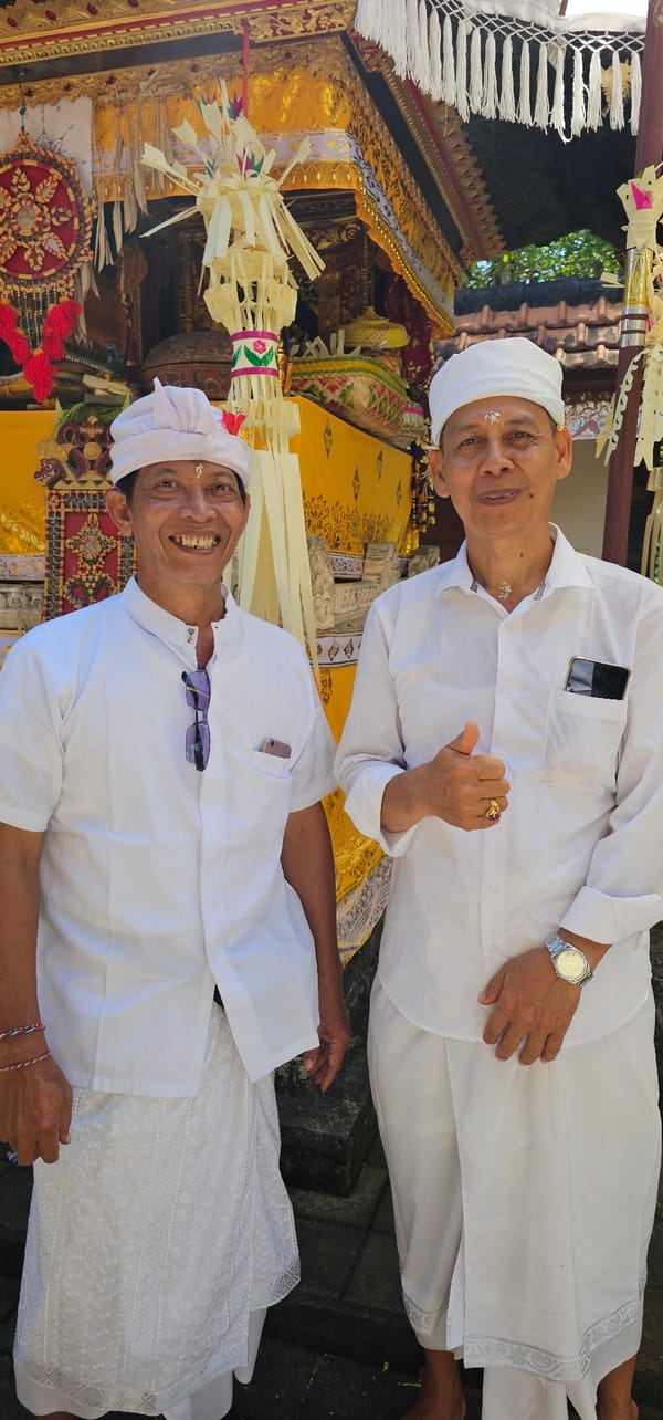 Traditional Balinese ceremony draws participants in white attire, Denpasar