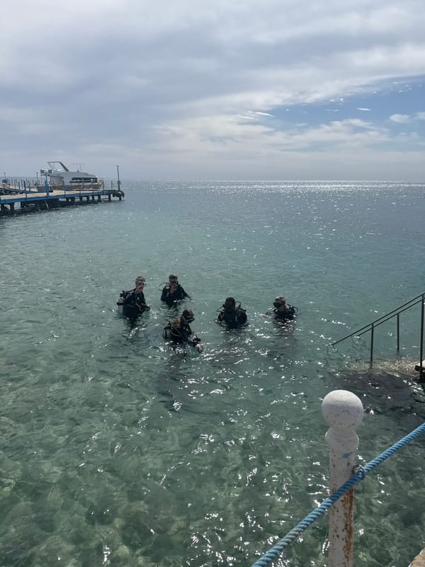 Divers prepare for underwater excursion near Safaga pier