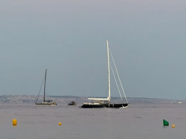 Mallorca afternoon: sailboats, beach at dusk, cocktails