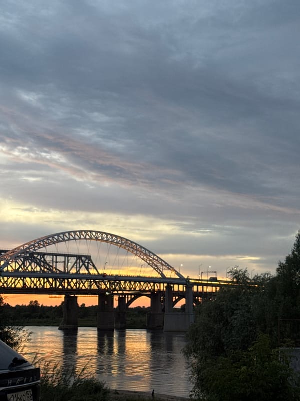 Fiery summer sunset over Nizhny Novgorod's river and skyline