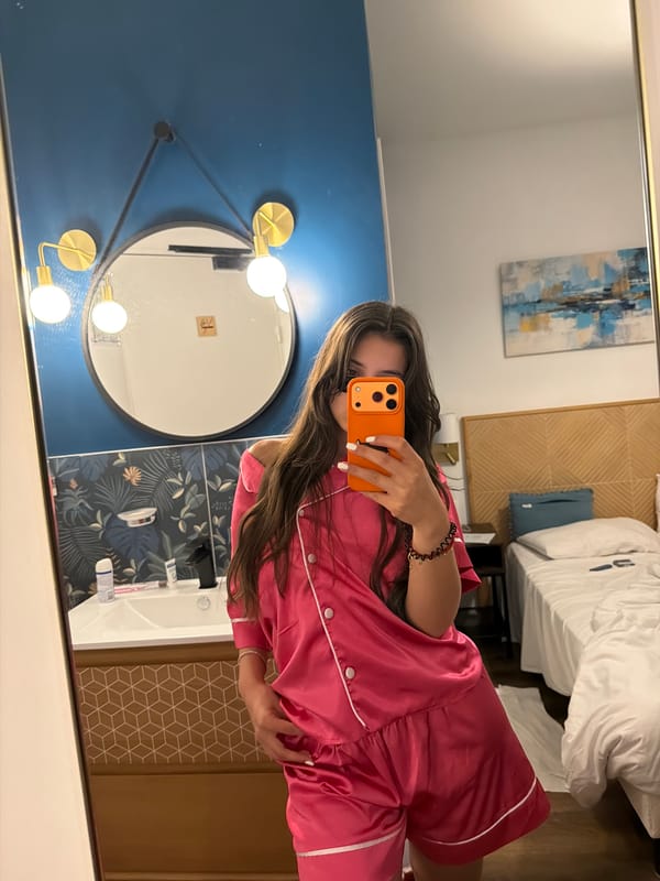 Woman takes mirror selfies in Cannes hotel room