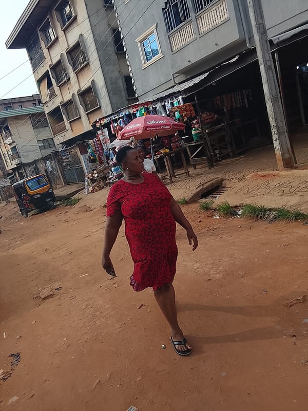 Daily life captured on Onitsha streets during overcast afternoon
