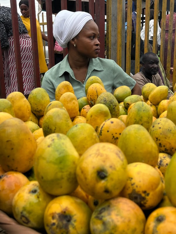 Street vendors and shoppers conduct daily business in Lekki