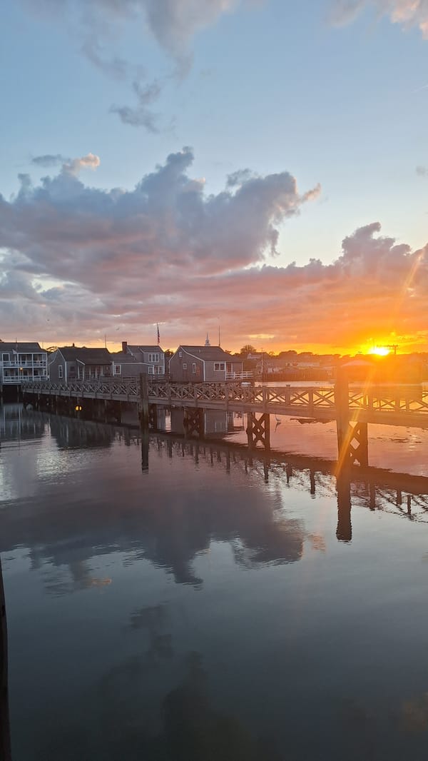 Sunset over Nantucket Harbor, docks and moored boats