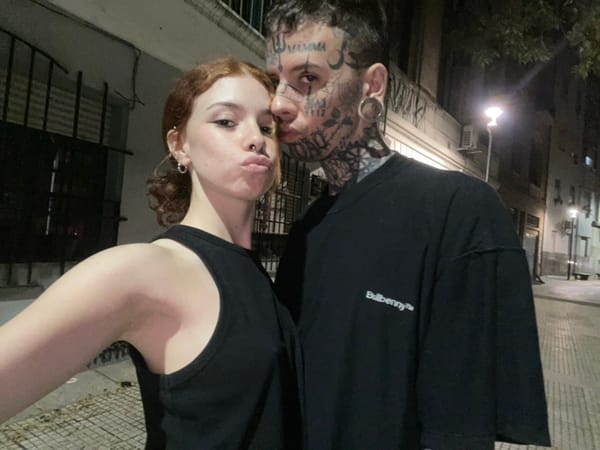 Late-night street scene captured in Buenos Aires with dancers, dog