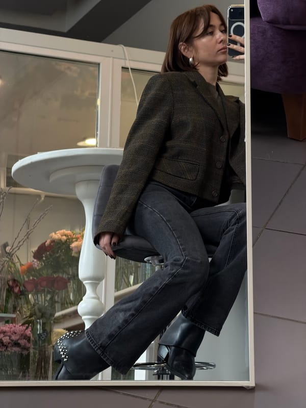 Woman with phone observed on decorative chair in Ust-Ilimsk