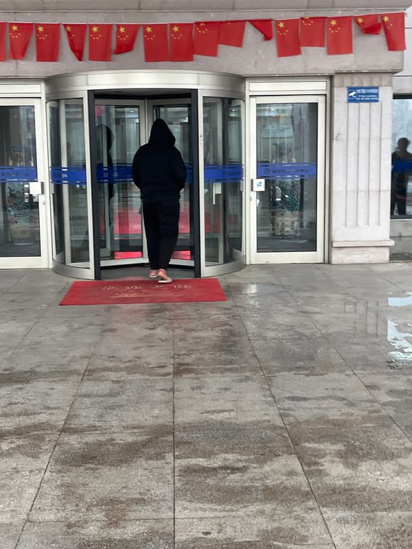 Rainy morning activities captured around Changchun building complex