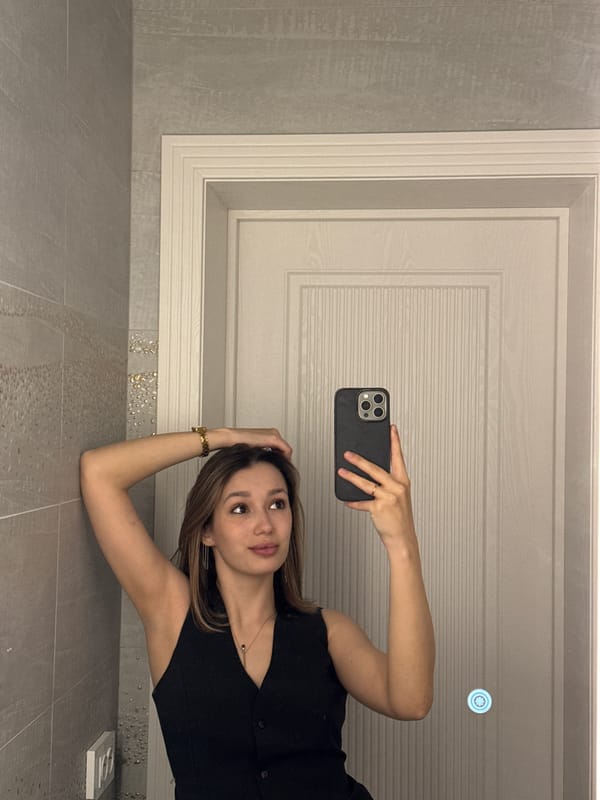 Woman documents indoor moments with selfies, vehicle spotted nearby