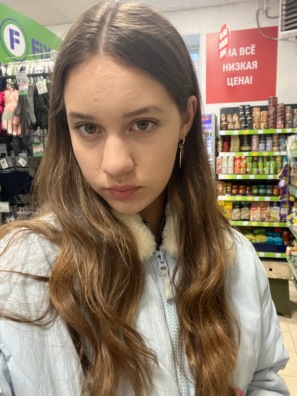 Woman shops at store in Novo-Nikol'skoe, Russia