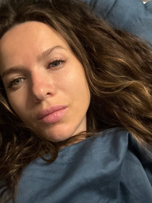 Woman resting on blue bedding captured in Dolgoprudny