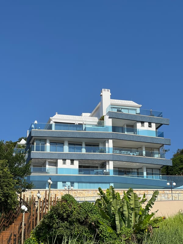 Evening scenes captured in Florianópolis show urban architecture, busy beaches