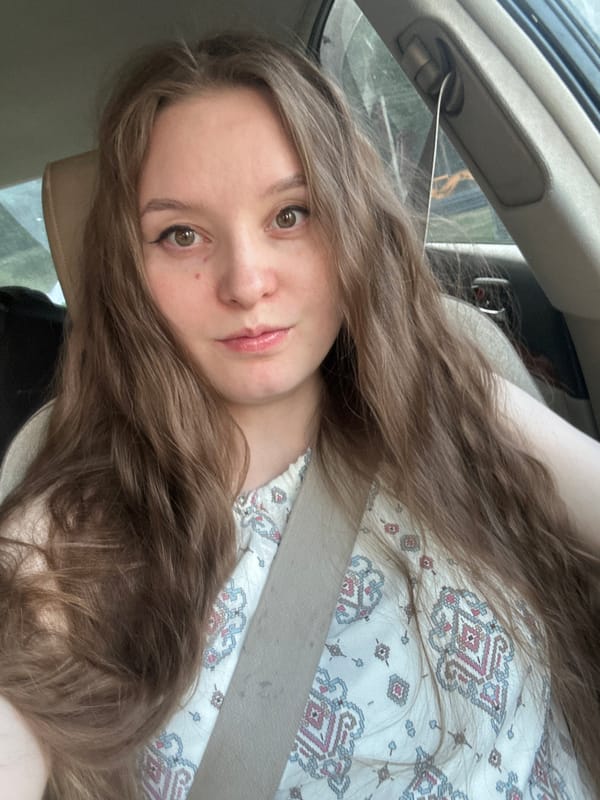 Woman photographed in car passenger seat in Noviy, Russia