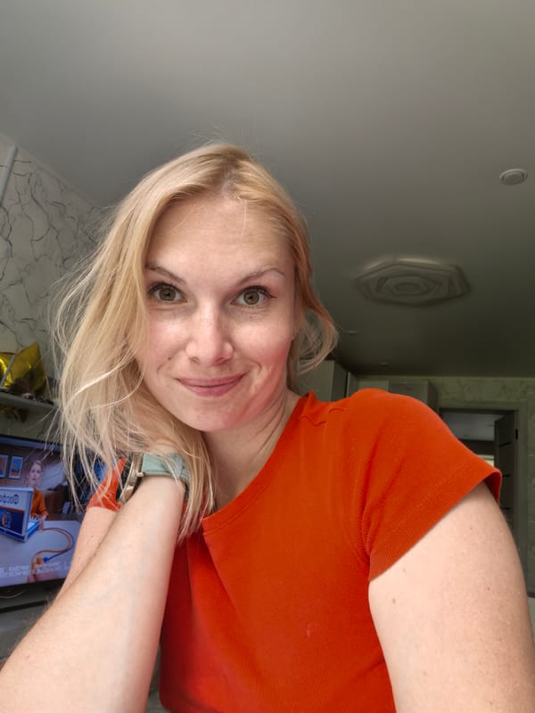 Indoor photo session in Sterlitamak home, orange outfit, multiple angles