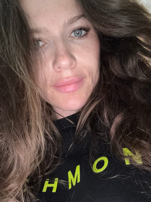 Woman takes selfie in Moscow wearing lettered shirt